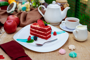 Cake Red velvet with berries on a white plate
