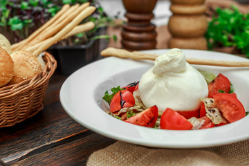 Italian young cheese - with juicy ripe tomatoes, olive oil, balsamic and salad