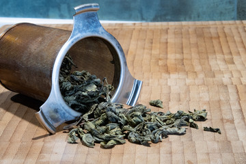 Steel tea strainer and large leaf green tea