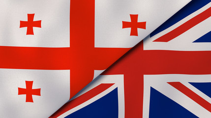 The flags of Georgia and United Kingdom. News, reportage, business background. 3d illustration