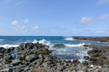 Fototapeta na wymiar rocks and waves on the beach