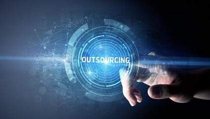 Hand touching OUTSOURCING button, modern business technology concept