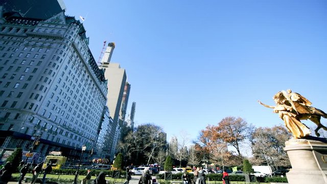 NEW YORK CITY, USA - DECEMBER 7, 2018: Grand Army Plaza in Manhattan. Buildings and flying birds in winter, slow motion