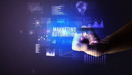 Hand touching MARKETING AUTOMATION inscription, new business technology concept