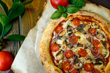 pizza with mozzarella cheese with tomatoes red onion and tenderloin