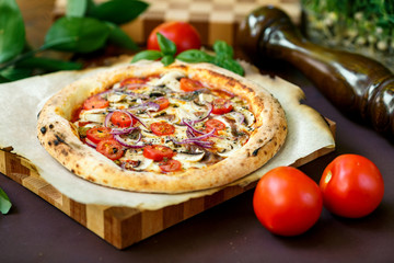 pizza with mozzarella cheese with tomatoes red onion and tenderloin
