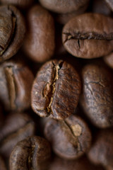 Extremely close-up background roasted coffee beans with gold streaks, good morning concept