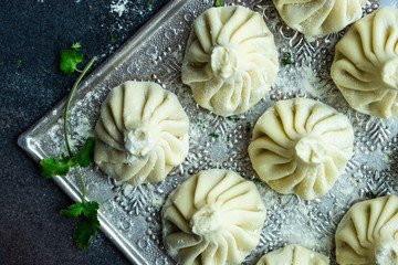 Traditional georgian khinkali dish on stone background