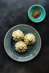 Traditional georgian khinkali dish on stone background
