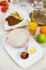 breakfast, oatmeal with butter, berries and orange juice
