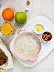 breakfast, oatmeal with butter, berries and orange juice