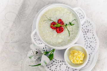 breakfast, rice porridge with butter, fruits and berries