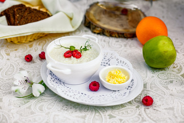 breakfast, rice porridge with butter, fruits and berries