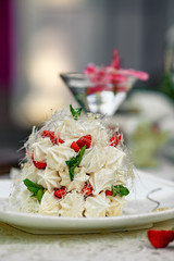 Pavlova cake with berries and mint, bise, dessert
