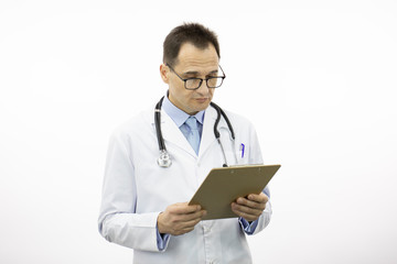 Handsome male senior age doctor in white coat and stethoscope seriously looking on clipboard with patient's medical diagnosis on isolated white background. Copy space. Health and medical concept