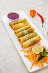 Pancakes stuffed with meat and carrots with spicy sauce