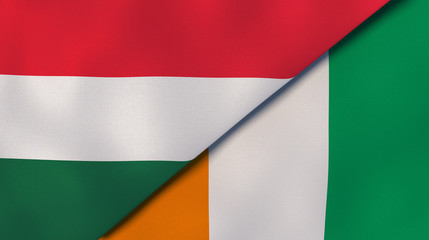 The flags of Hungary and Ivory Coast. News, reportage, business background. 3d illustration