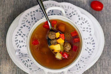 soup with vegetables and meatballs for lunch