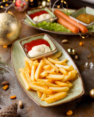 french fries and sausages with fry sauce