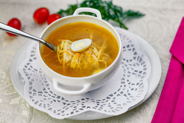 chicken soup with noodles and eggs with vegetables serving for lunch
