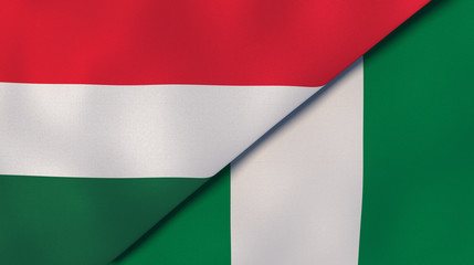 The flags of Hungary and Nigeria. News, reportage, business background. 3d illustration