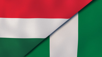 Obraz premium The flags of Hungary and Nigeria. News, reportage, business background. 3d illustration