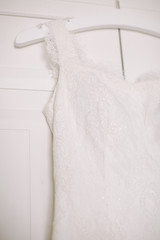 Wedding dress hanging on the wardrobe.