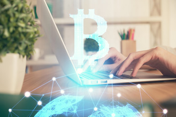 Double exposure of woman hands typing on computer and crypto market theme hologram drawing....