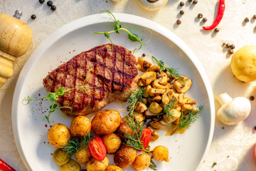 delicious steak with mushrooms and baked potatoes with jalapeno, healthy food