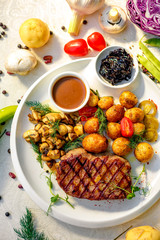 delicious steak with mushrooms and baked potatoes with jalapeno, healthy food