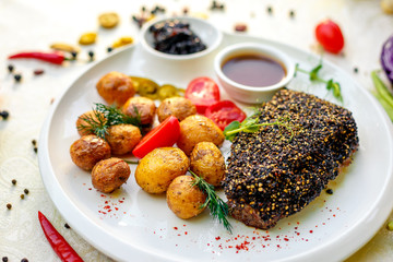 Pepper Steak with Baked Potatoes Pickled Onion and Vegetable Sauce