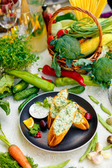 appetizing garlic bread with cheese and fresh vegetables