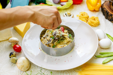 Spaghetti Carbonara - pasta with smoked bacon and mushrooms in creamy sauce and Parmesan cheese