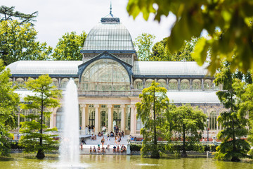 Crystal Palace in the center of El Retiro Park, next to a small lake