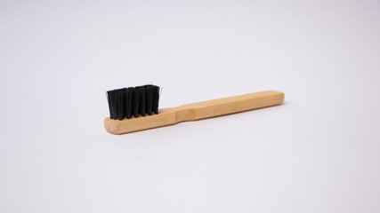 wooden brushes for cleaning shoes on the white background.