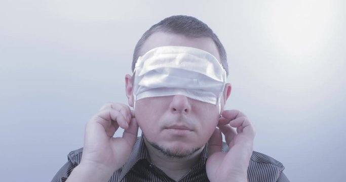 Failure to comply with quarantine. Portrait of a bearded man in medical mask. Ignoring the virus