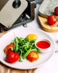 fried meat and lemon with ketchup