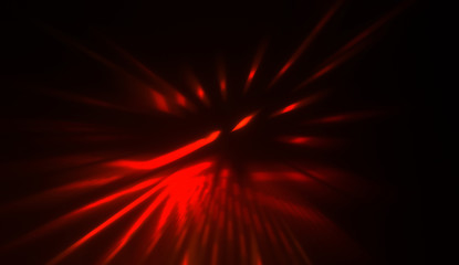 Light particles in motion, creating a burst of glowing multicolored rays on a black background. Energetic glow lights wallpaper.