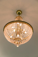Obraz premium Simple chandelier on the ceiling
