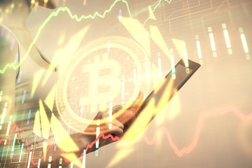 Double exposure of blockchain business sketch hologram and woman holding and using a mobile device.