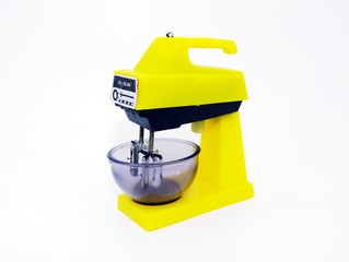 Dourados, MS, Brazil - April 1, 2020. Antique toy in the shape of a Food mixer 1970s, works manually. Yellow and black with with your accessories. Same as the real one.