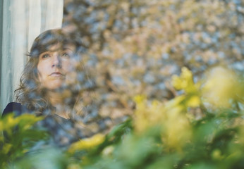 Girl looking outside during COVID-19 Lockdown spring time Oxford