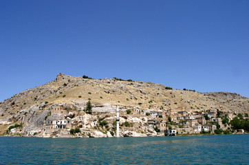 Fototapeta na wymiar Minaret at sunken village Savasan in Euphrates River (Firat), Halfeti, Gaziantep, Turkey.