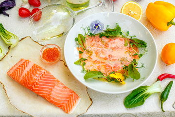 Fillet of red fish with a fresh piece of cooking with greens and vegetables