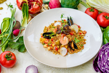 ice risotto with seafood, mussels, shrimps and vegetables, healthy food