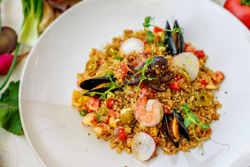 ice risotto with seafood, mussels, shrimps and vegetables, healthy food