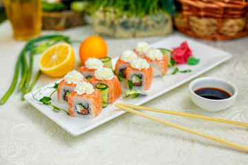 Sushi Philadelphia with soy sauce and chopsticks
