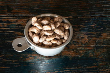 Uncooked Pinto Beans in a Measuring Cup