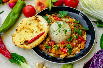 Mexican food, fajitos with vegetables, wheat cake and hot pepper on the table decorated with vegetables