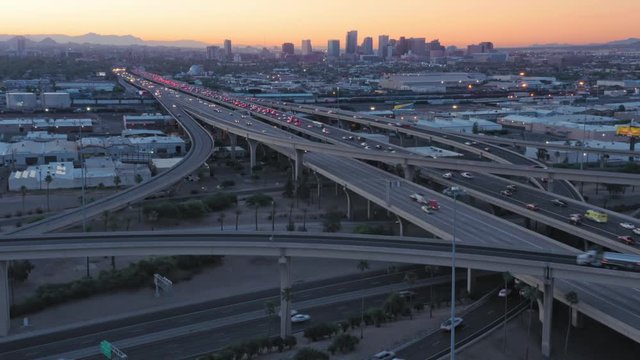 Aerial: Rush hour freeway traffic on Interstate at sunrise. Phoenix, Arizona, USA
